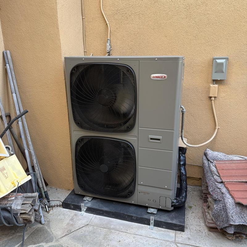 EL18KSLV Condenser unit installed on pad outdoors