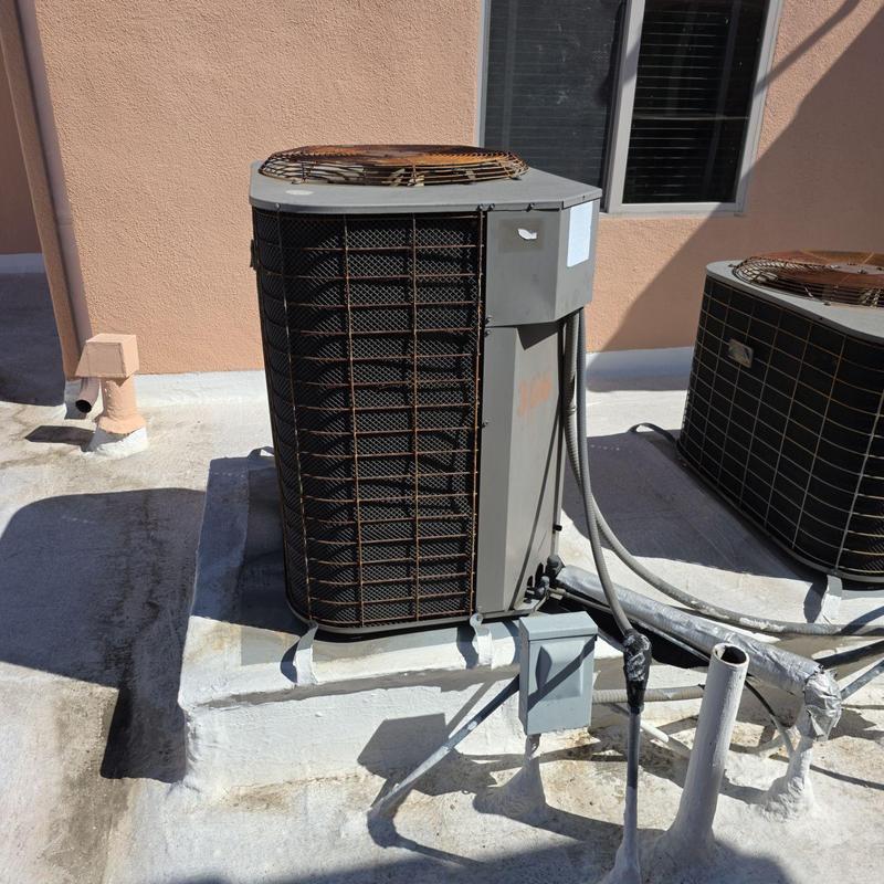 Heat pump unit on rooftop with electrical connections