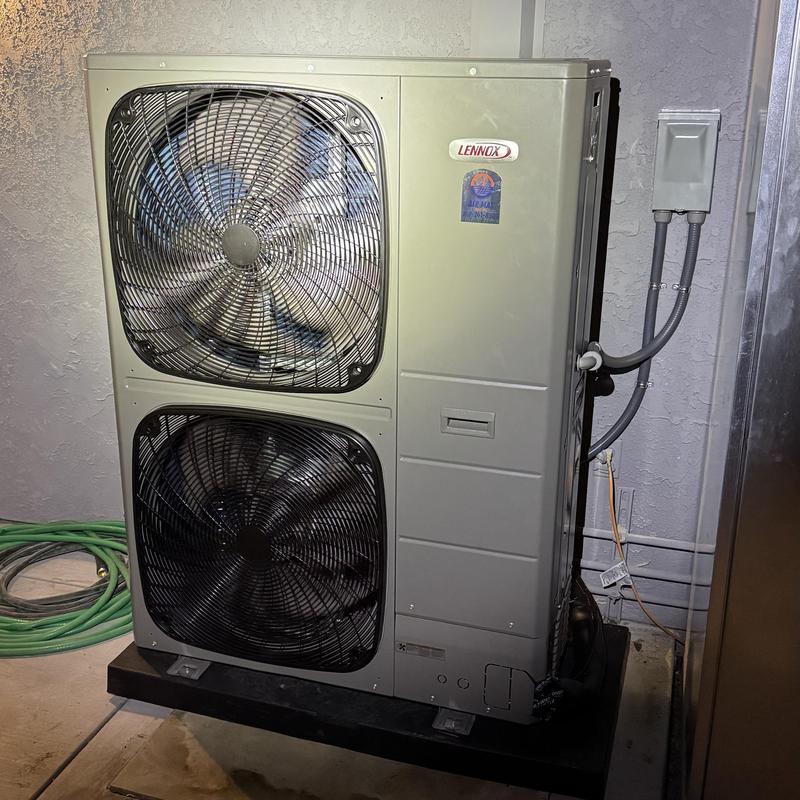 EL18KSLV Lennox condenser unit on pad outdoors