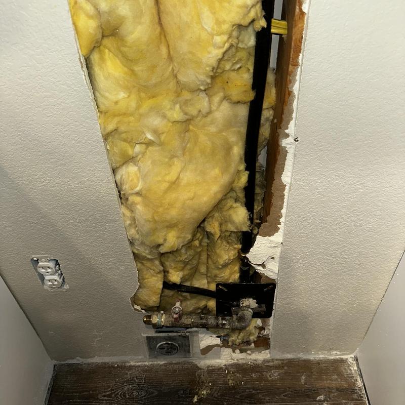 CSST gas line with insulation and drywall cutout