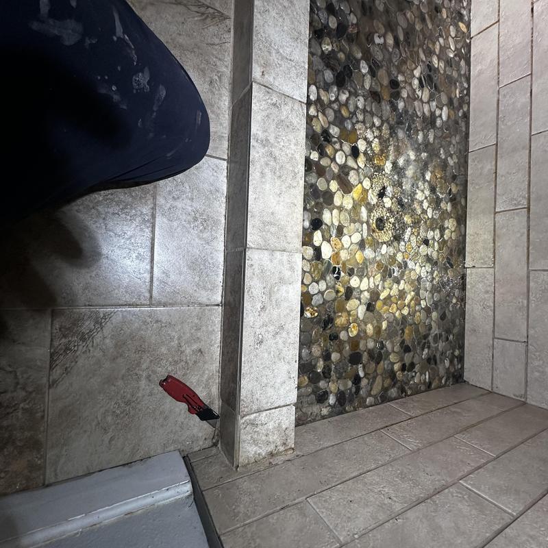 Shower pan water leakage test with pebble floor tiles