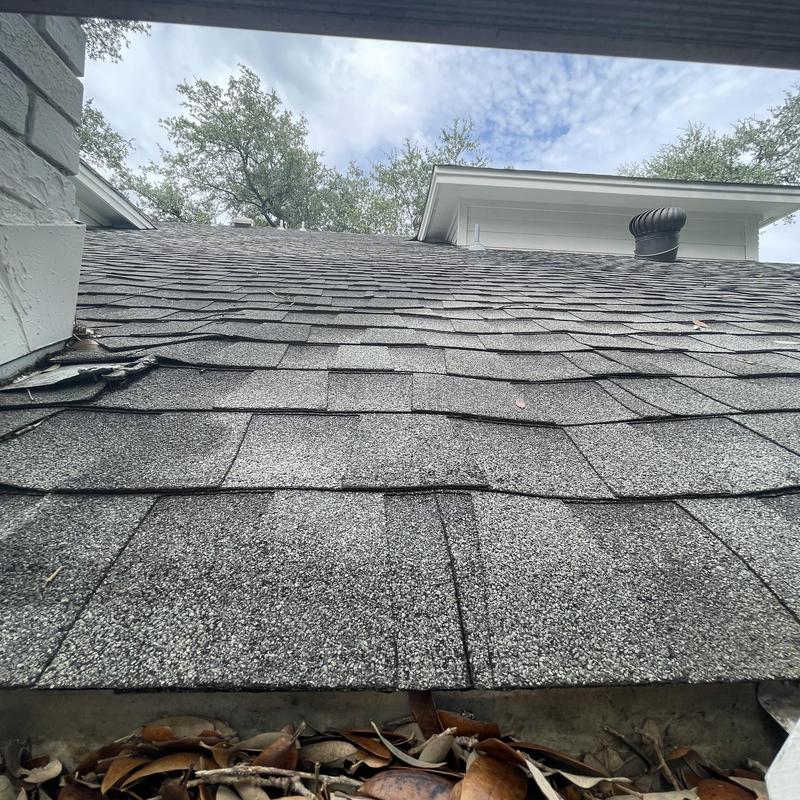 Chimney flashing and shingle separation on roof