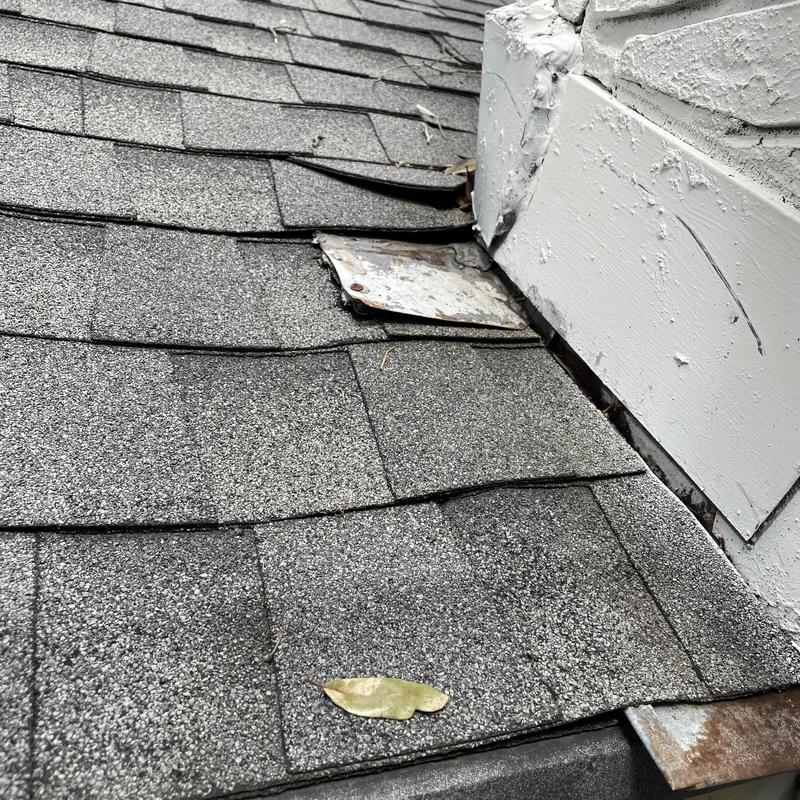 Chimney flashing separating from roof shingles