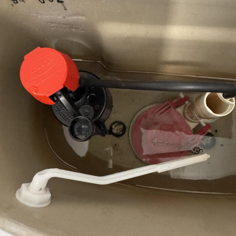 Toilet fill valve and flapper inside tank