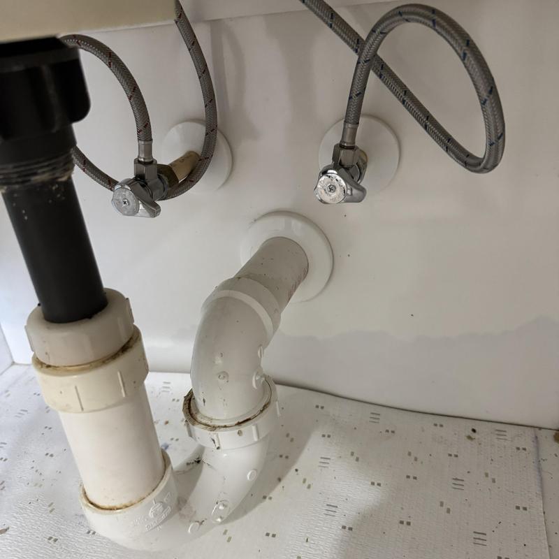 PVC sink drain pipes with shut off valves and supply lines