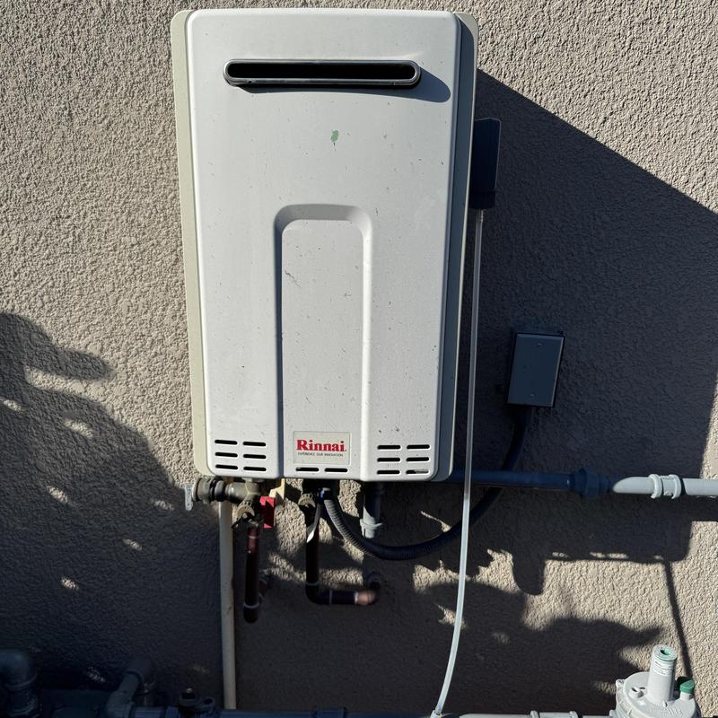Rinnai tankless water heater mounted outdoors