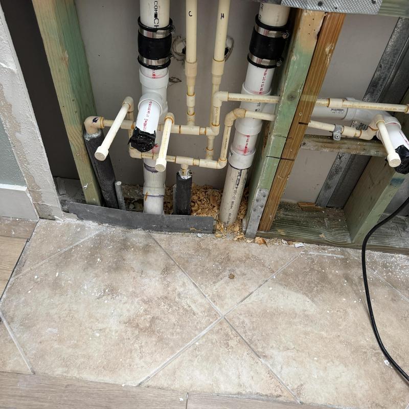 PVC water drain pipes under bathroom vanity installation