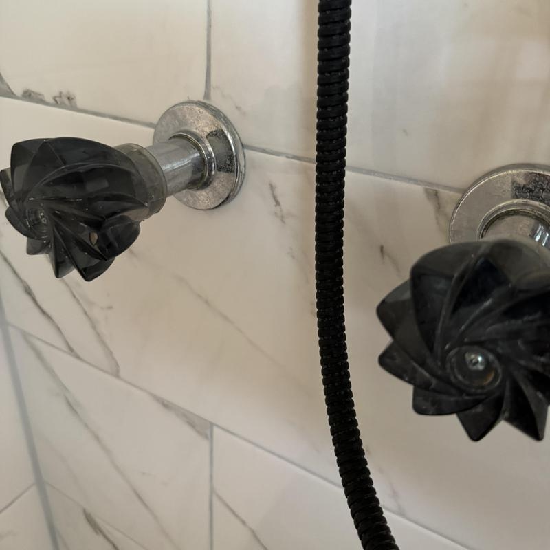 Two-handle shower valve with black knobs and trim