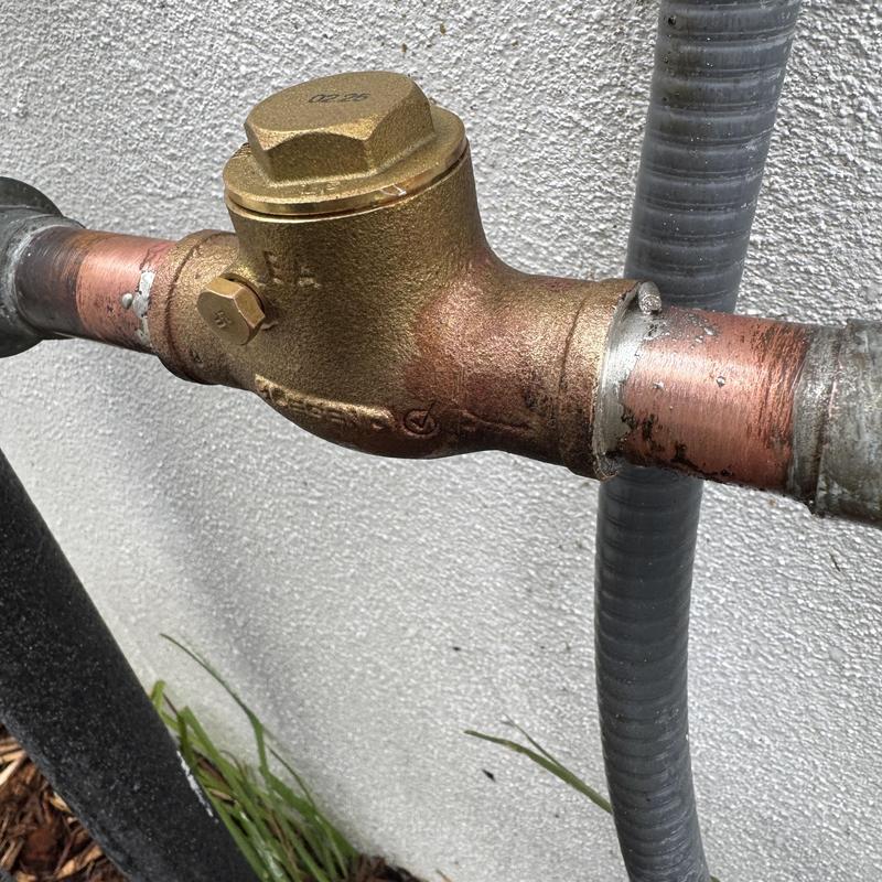 Hot side check valve on tankless water heater piping