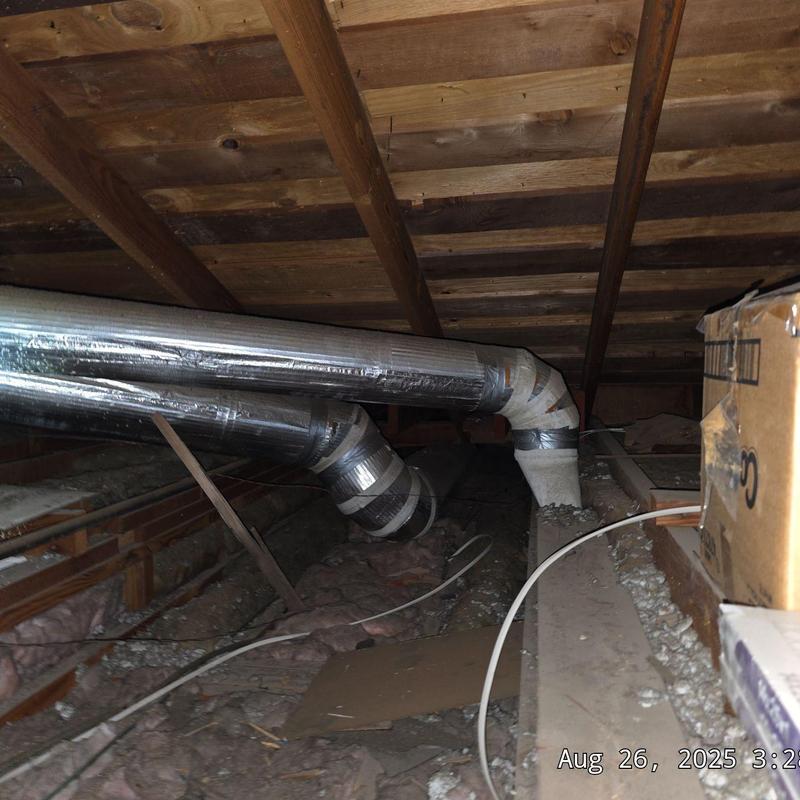 Furnace ductwork with insulation in attic space