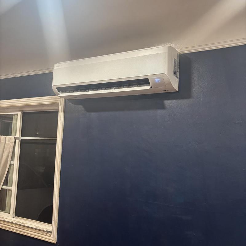 18K BTU Mini Split Head Unit on blue wall 18K BTU Mini Split Head Unit on blue wall