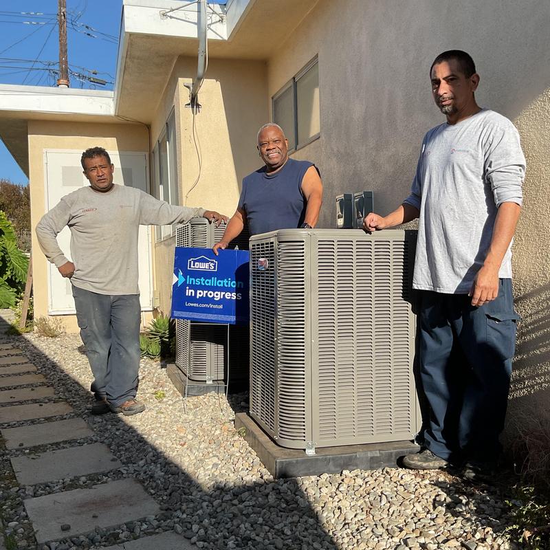 ML14KC1 condenser units with installation crew outdoors