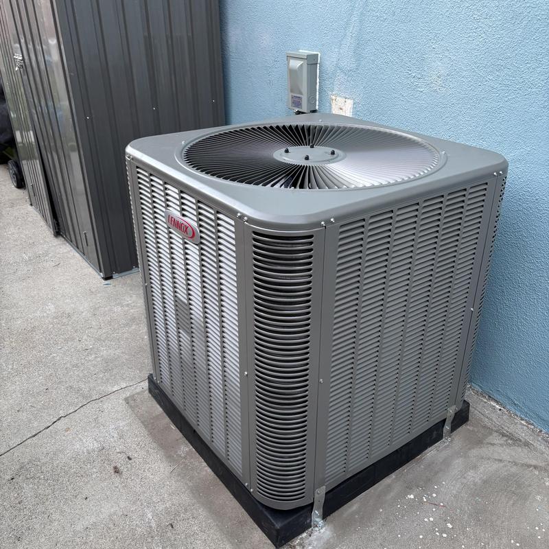 ML14KC1 condenser unit installed outdoors next to wall