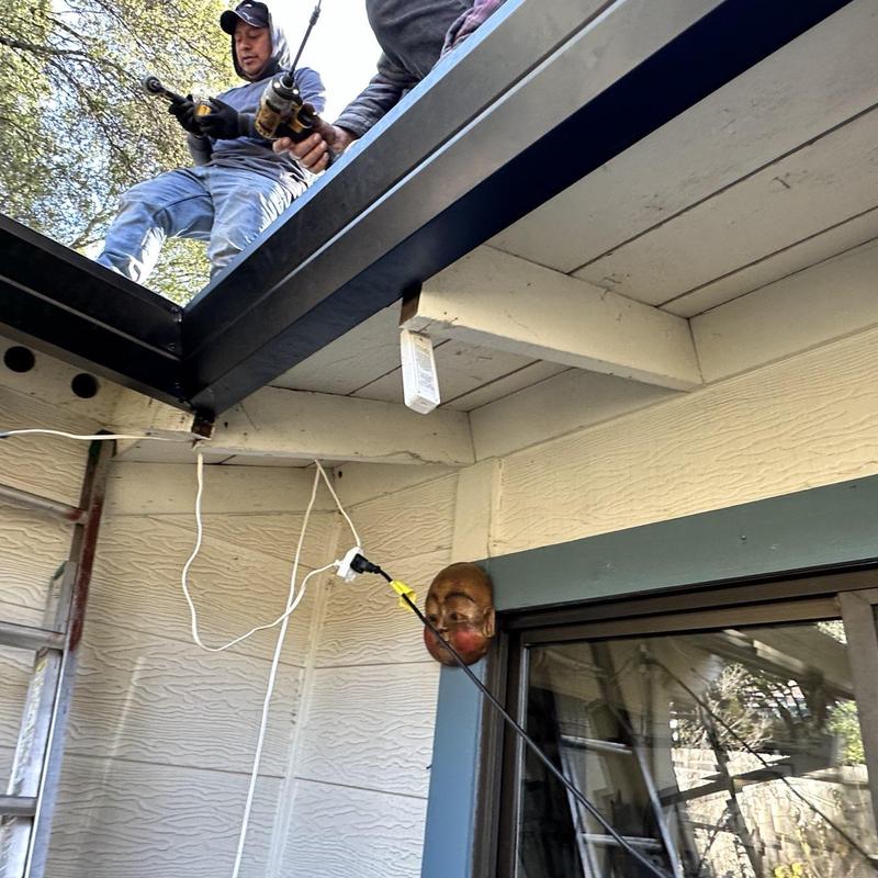Steel seamless gutters installation with guards in Sonora