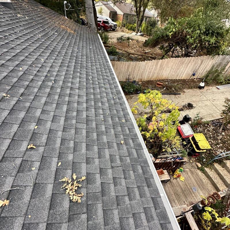 Steel seamless gutter with leaf guard on house roof