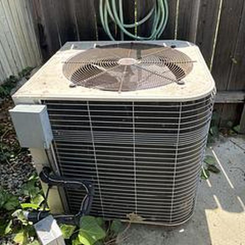 EL18KSLV condenser unit outdoors with fan grille