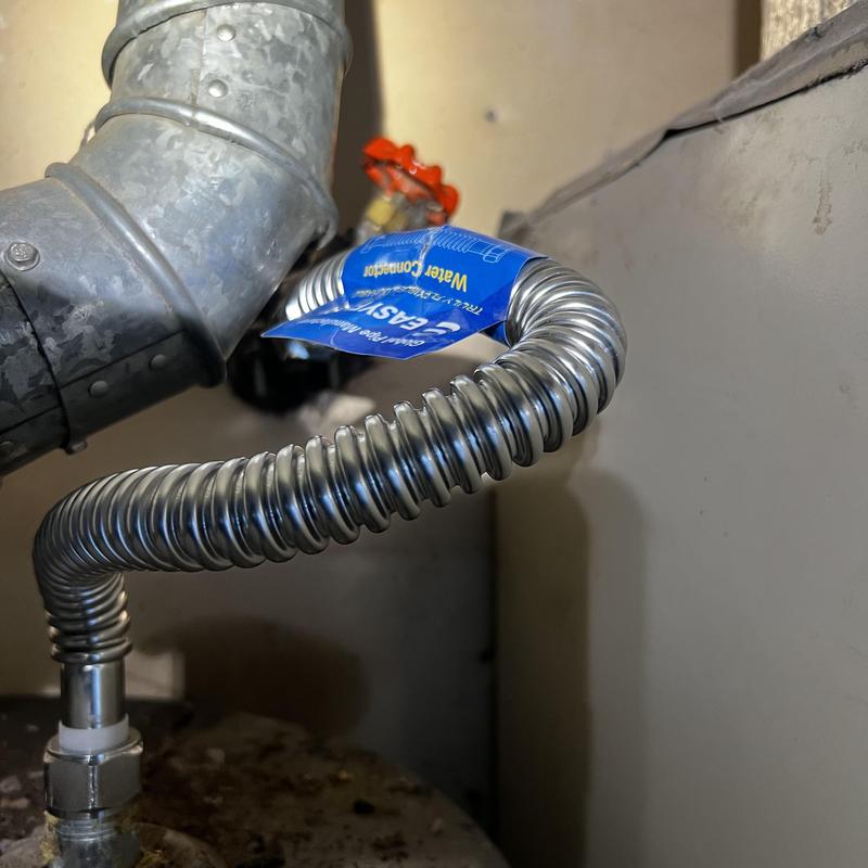 Water heater flexible connector installation with tag