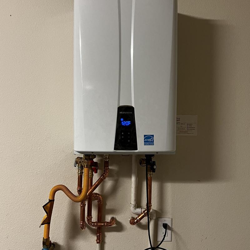 Tankless water heater with new copper plumbing and vent