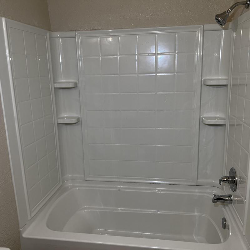 Right hand bathtub with new chrome shower trim