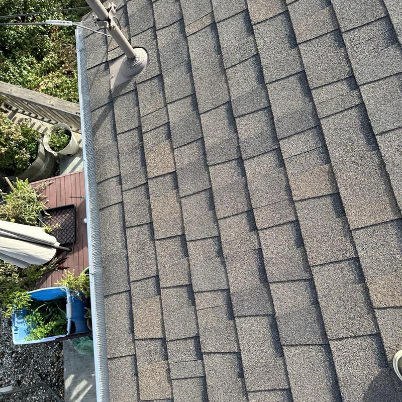 Steel seamless gutters with Leaf Blaster guards on shingle roof Steel seamless gutters with Leaf Blaster guards on shingle roof