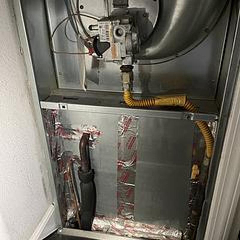 Gas furnace installation with ductwork and piping