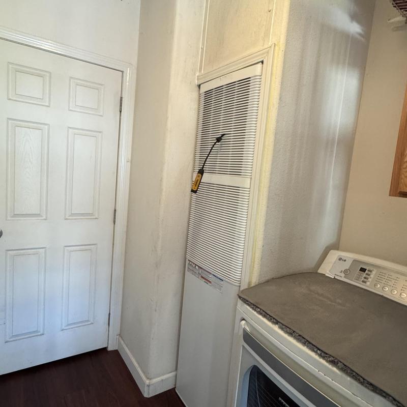 Wall-mounted furnace with attached inspection tool