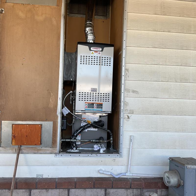 Lennox SL280UH furnace installed in outdoor enclosure