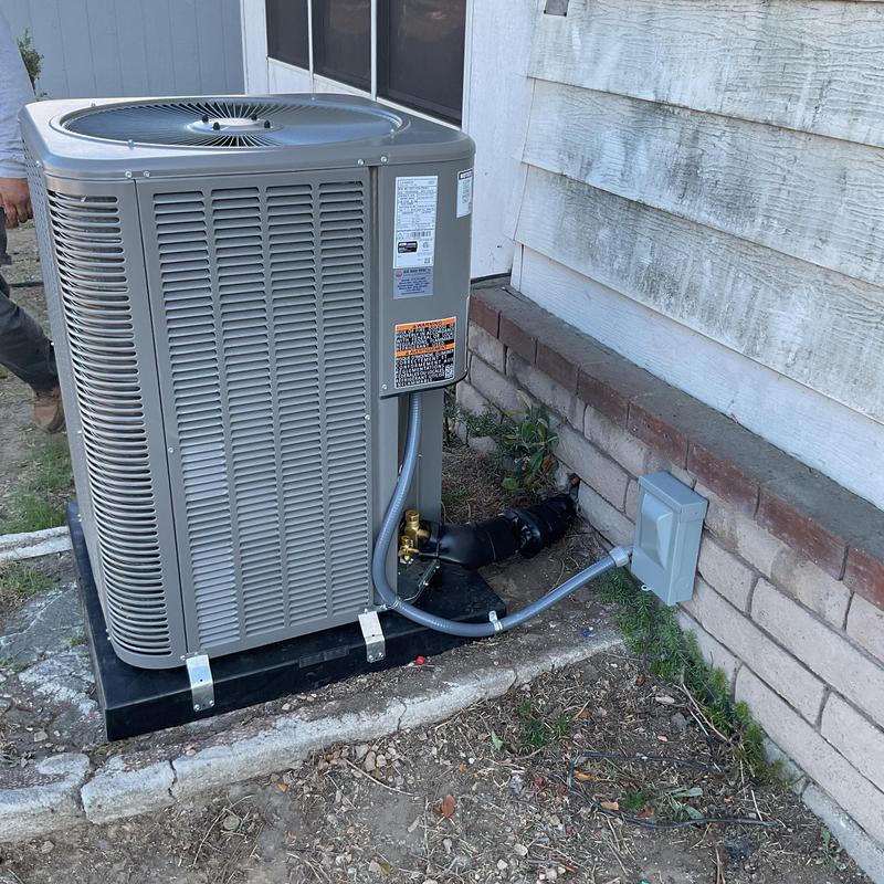 ML14KC1 condenser unit installed outside home
