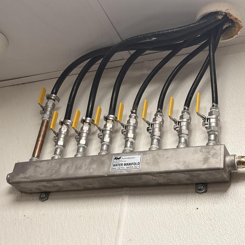 Stainless steel water manifold with valve connections