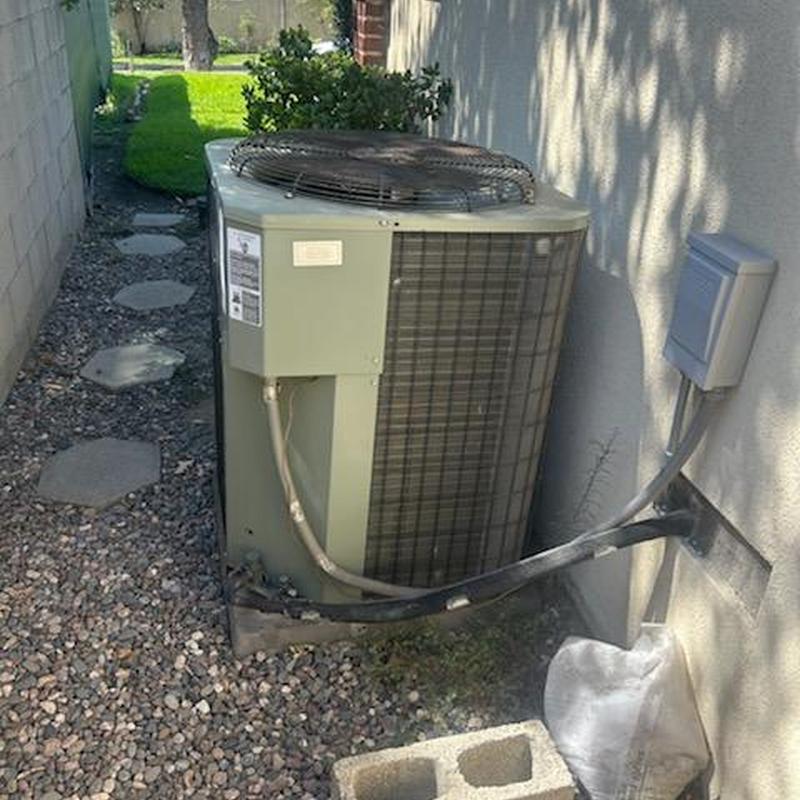 ML14KC1 condenser unit installed next to house wall