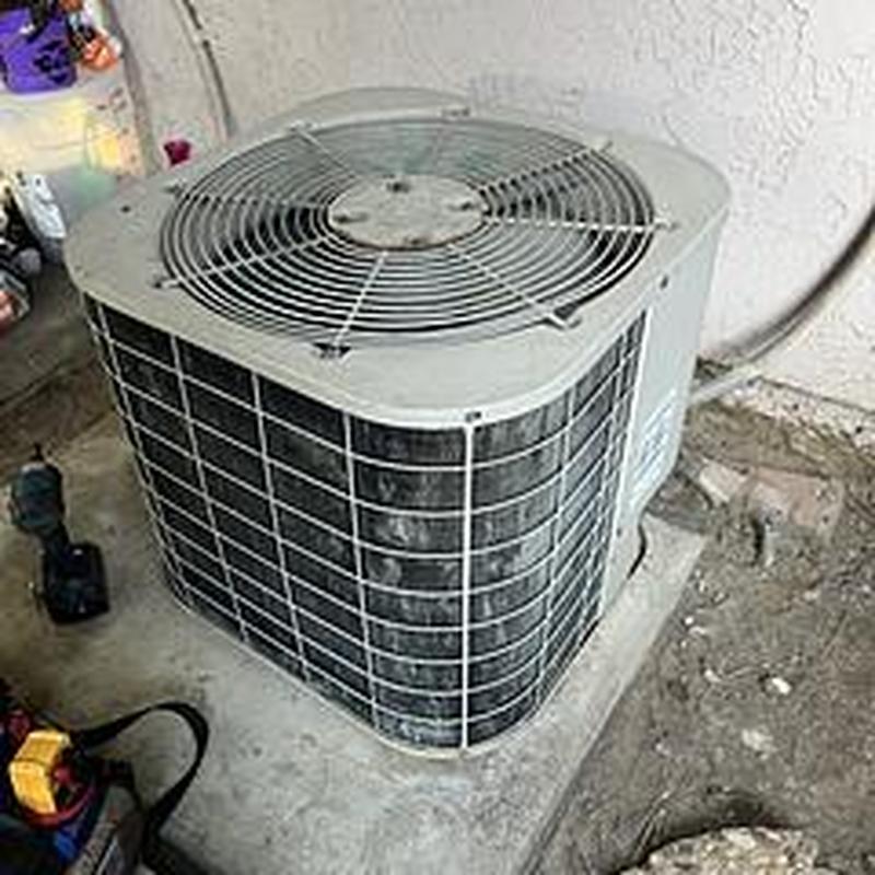 Condenser unit ML14KC1 on concrete slab outdoors