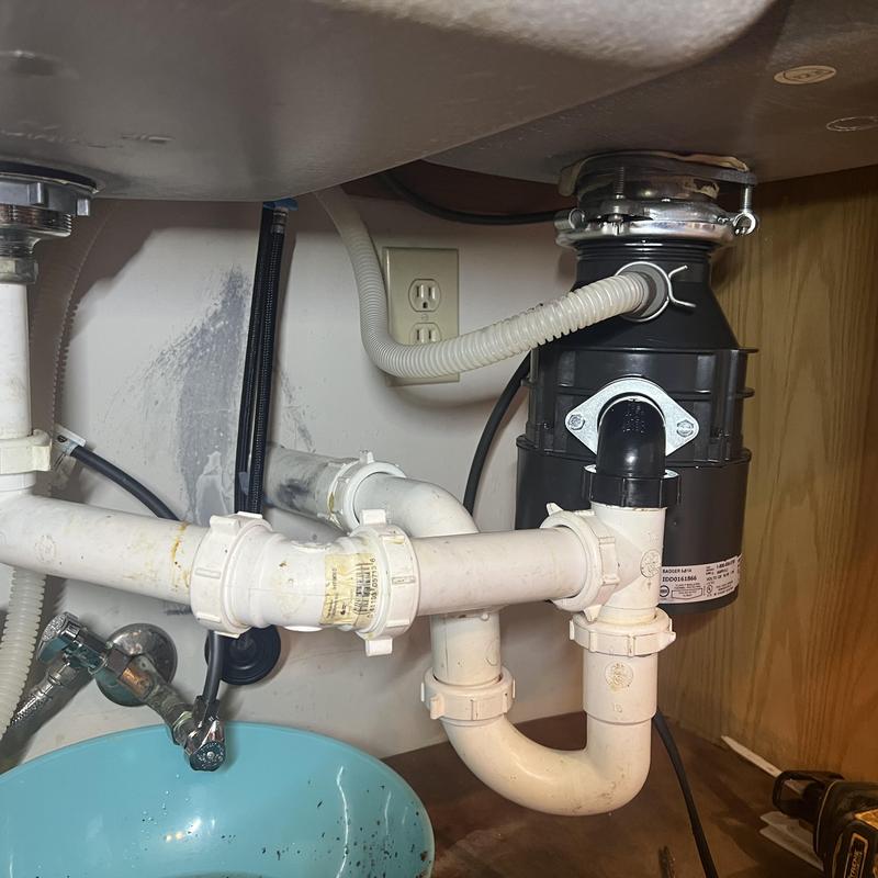 Garbage disposal unit and kitchen sink drain pipes