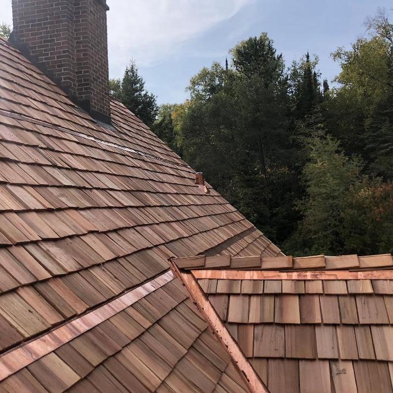 Hand split cedar shake roof with copper flashing