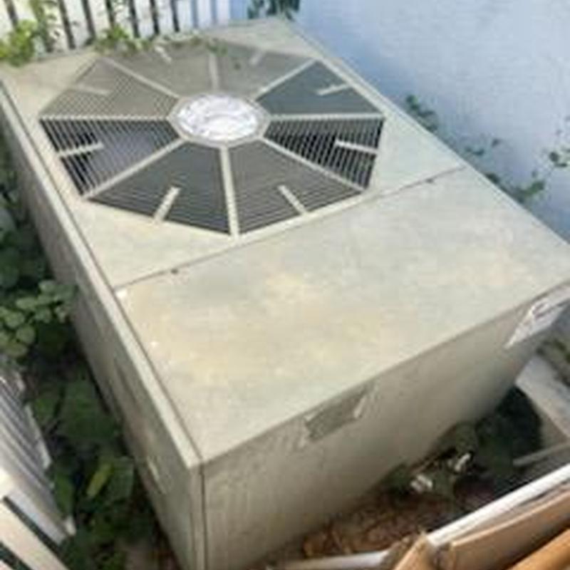 ML14KC1 condenser unit installed outdoors in yard