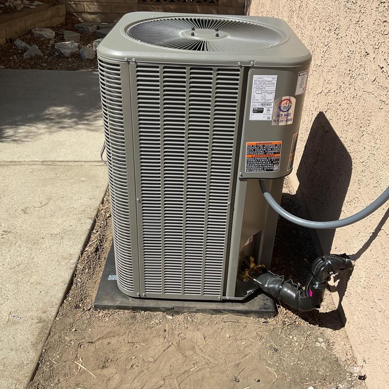 ML14KC1 condenser unit installed next to house wall