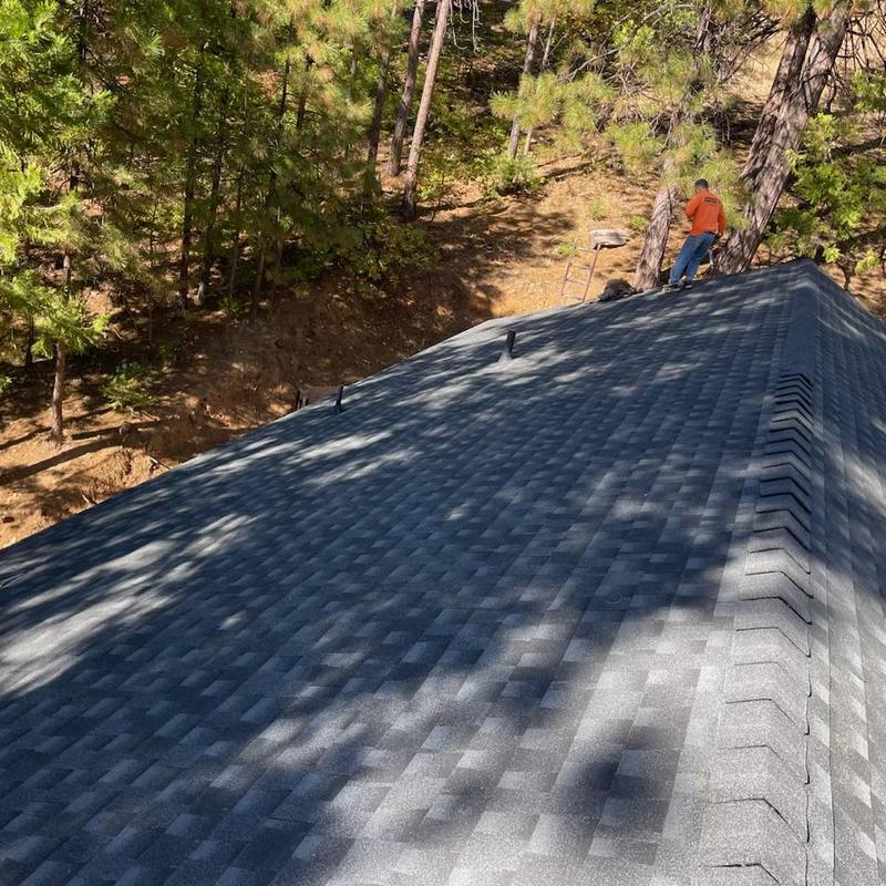 GAF Lifetime asphalt roof installation in forested area