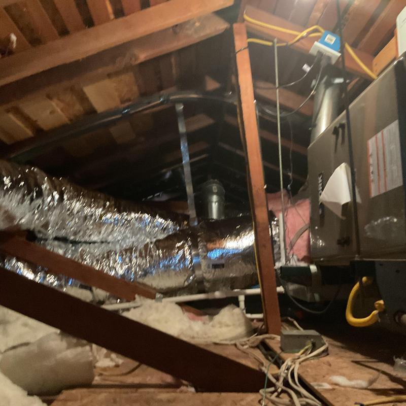 Flexible ductwork installation in attic with HVAC unit Flexible ductwork installation in attic with HVAC unit