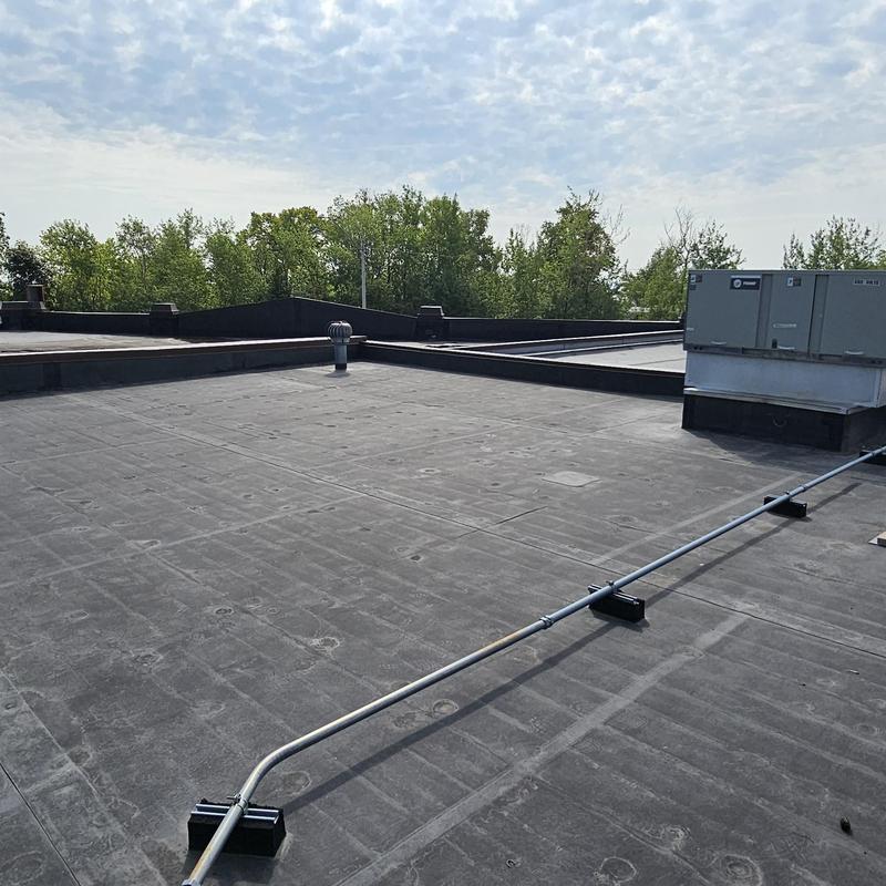 EPDM rubber roof with pipe supports and HVAC unit