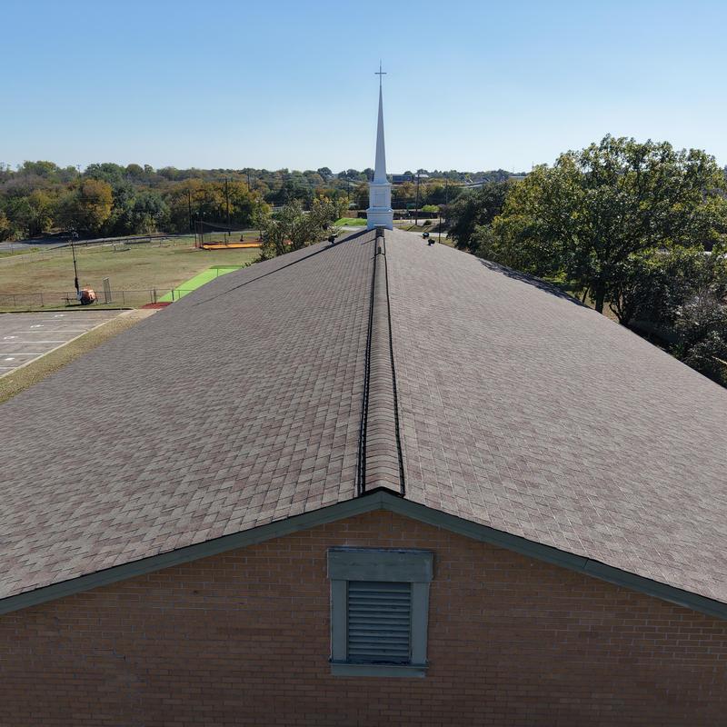 Church roof shingles replacement on church roof ridge
