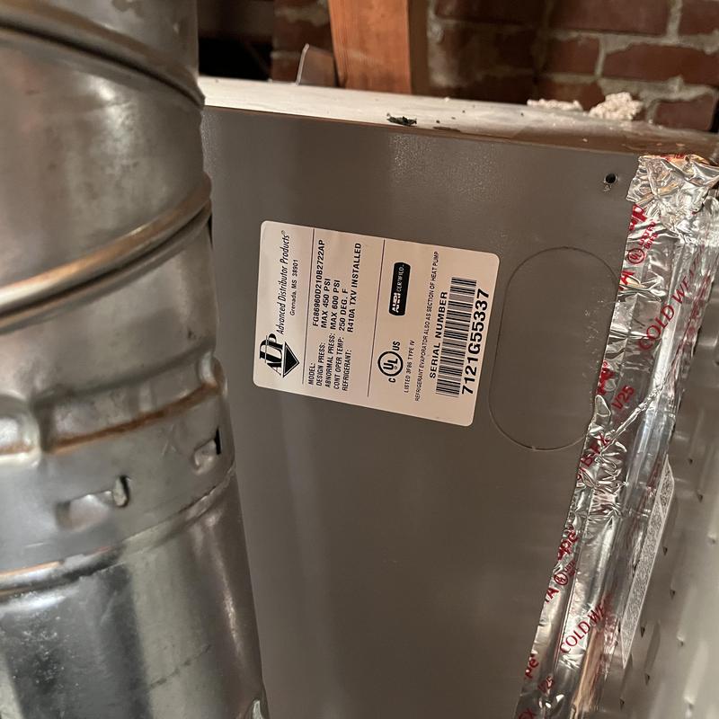 Furnace unit label showing model and specs