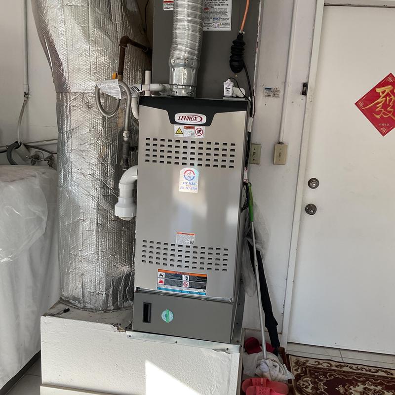 Lennox EL180UH furnace installed in residential garage