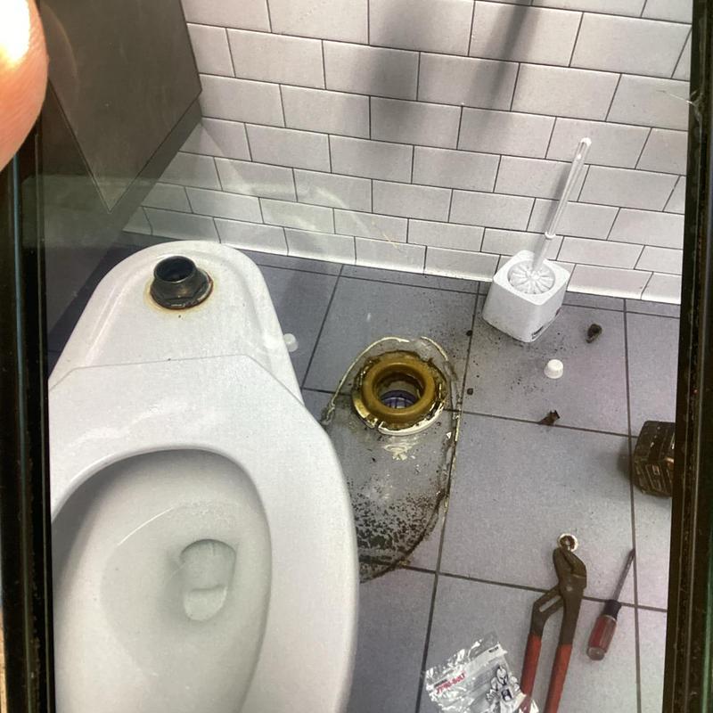 Toilet flange and spud replacement with tools nearby