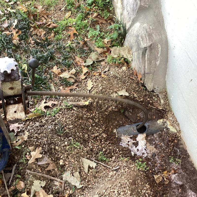 Septic tank main line cleaning with drain snake tool