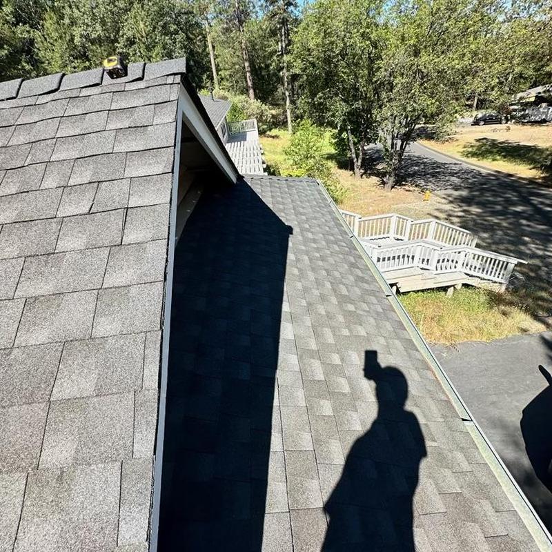 GAF Lifetime asphalt roof with ridge vent and gutters