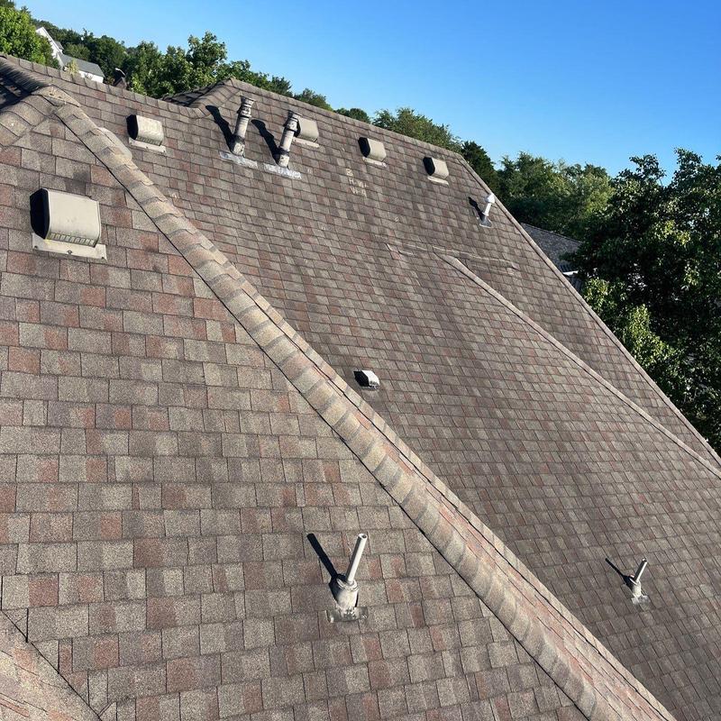 Asphalt shingle roof with vents after wind inspection