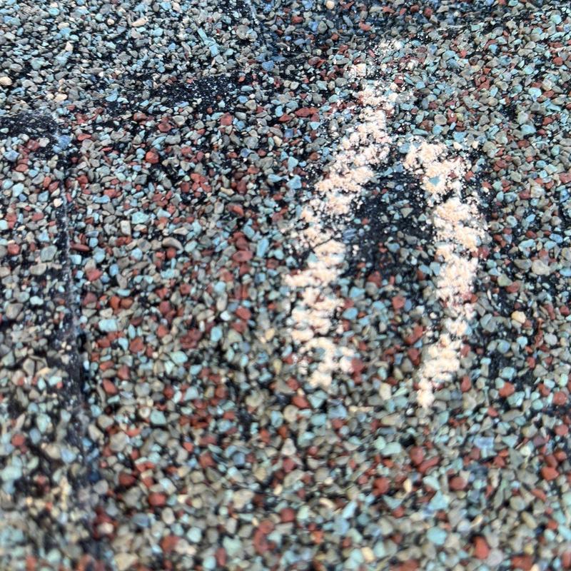 Roof shingles granule damage marking on asphalt shingles