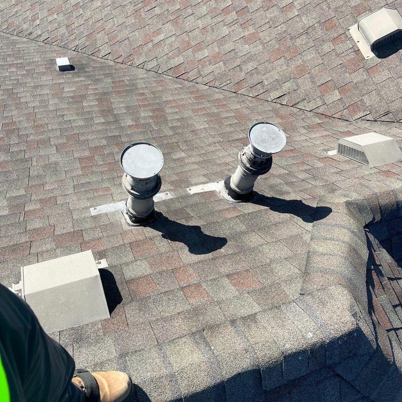 Roof shingles with vent pipes and flashing repair