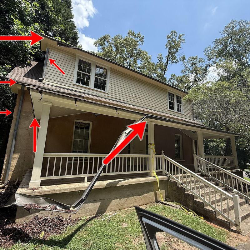 Gutter and downspout system on residential home exterior