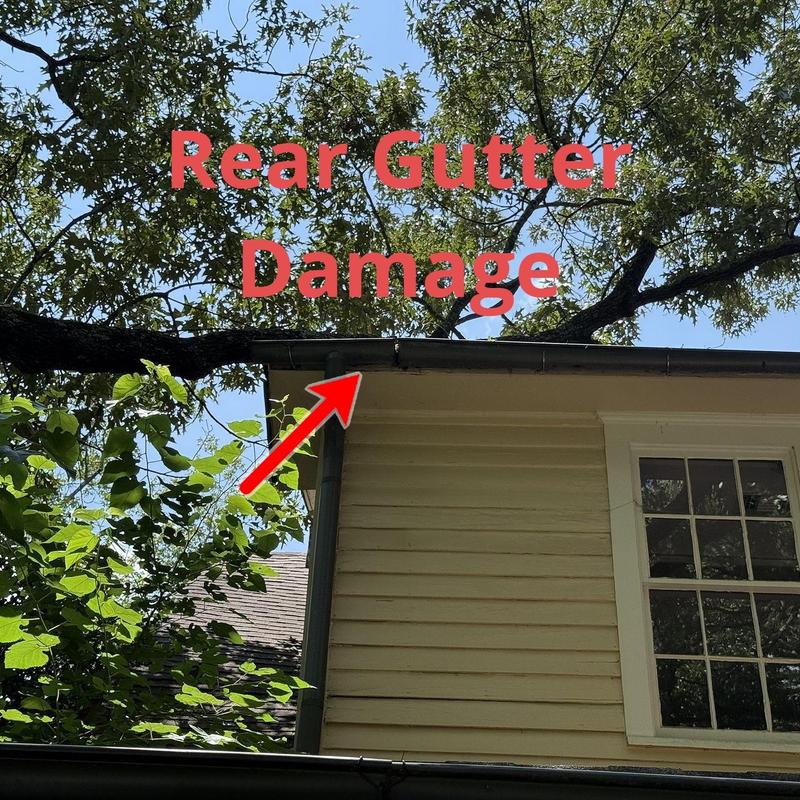 Gutter and downspout damage on rear house exterior