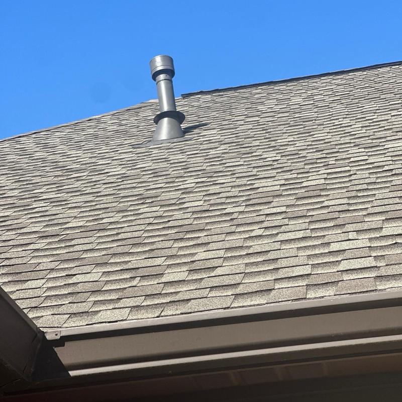 Furnace vent pipe flashing and roof shingles in Florence, MS